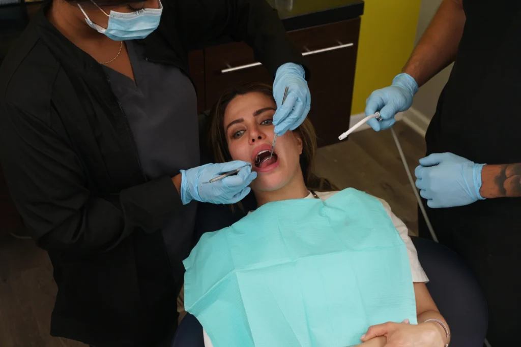 Woman getting dental emergency care at Wicker Park Dental Group Office
